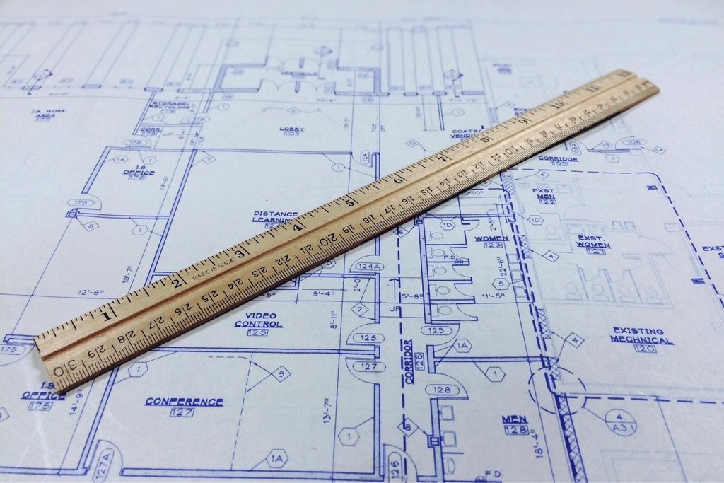 Architectural blueprint with a wooden ruler