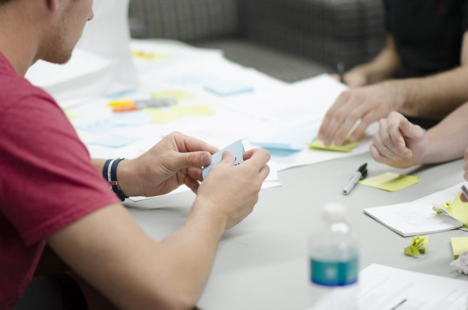 Team planning with sticky notes on a table